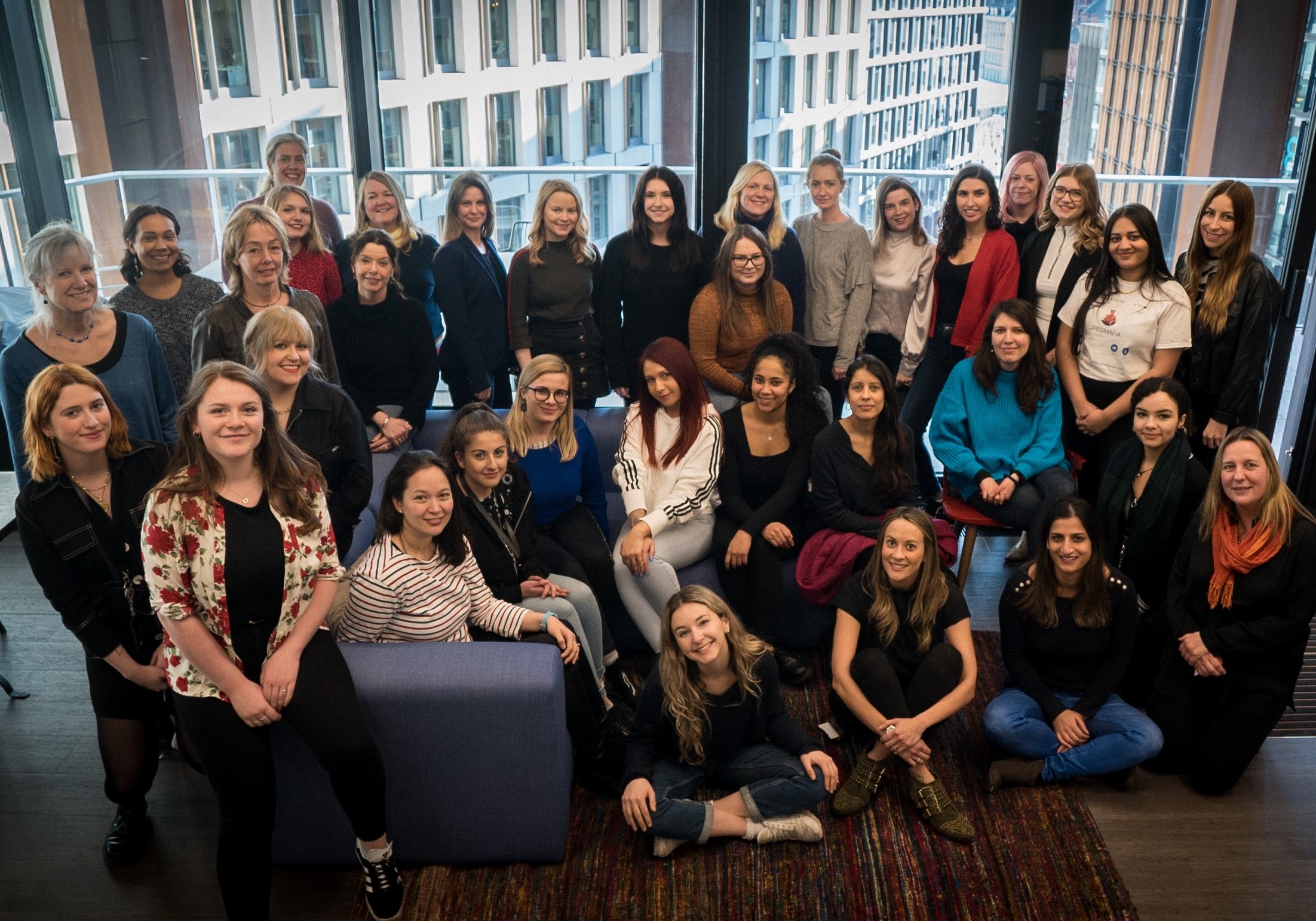 UMPG UK staff on sofa for International Women's Day
